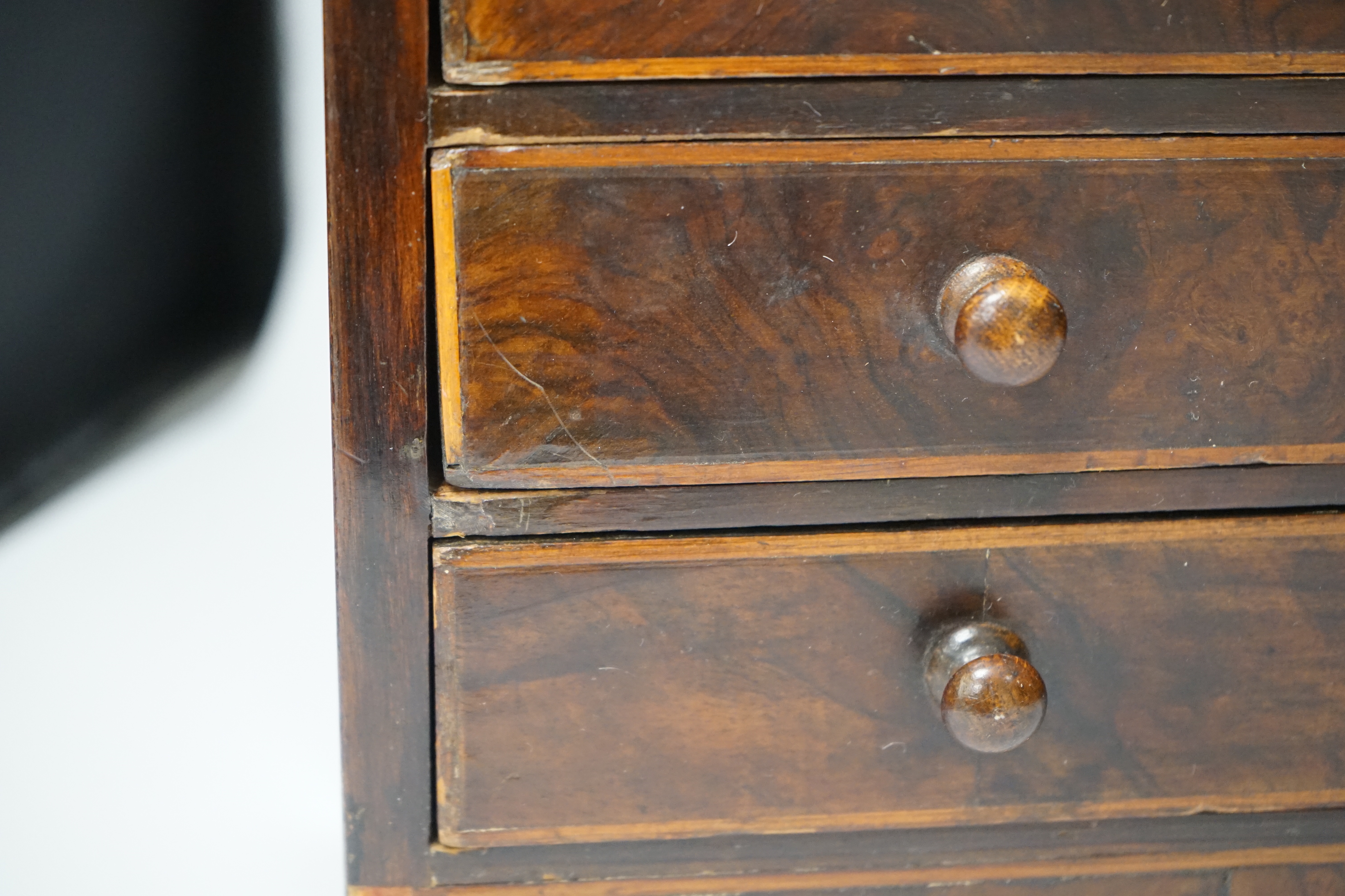 An early Victorian miniature walnut cupboard, 36cm x 50.5cm x 16.5cm